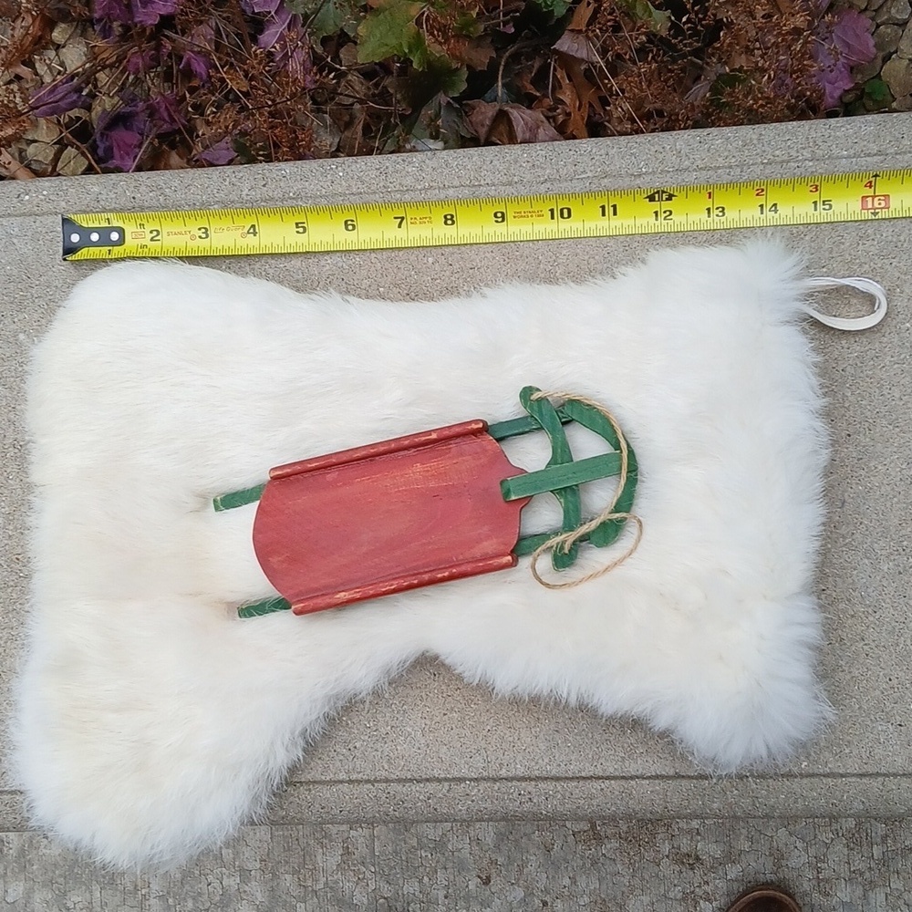 White Rabbit Fur Christmas Stocking with Red and Green Sled